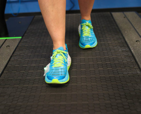 Man`s feet on treadmill